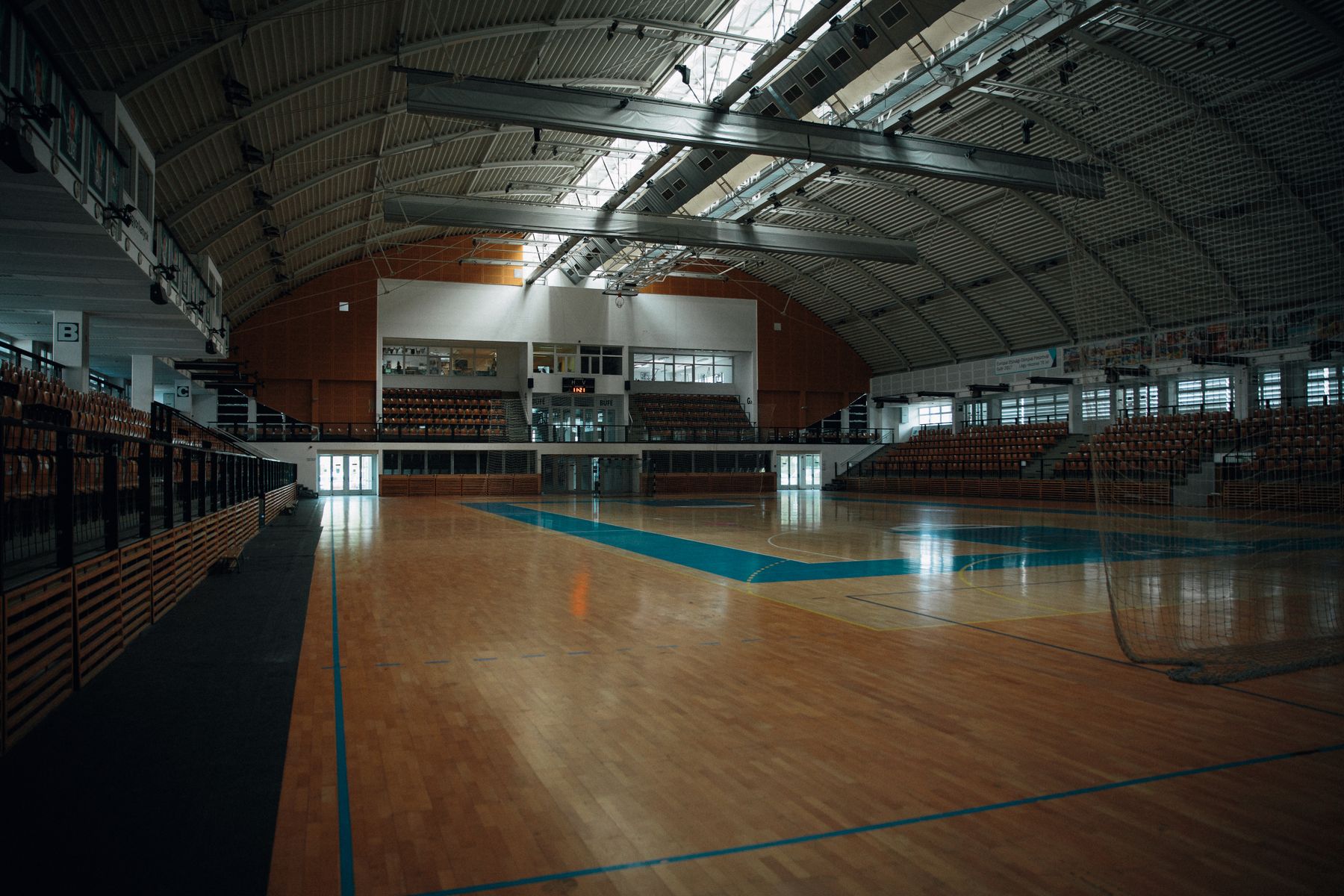 An indoor sports court, with its lines and playing surface